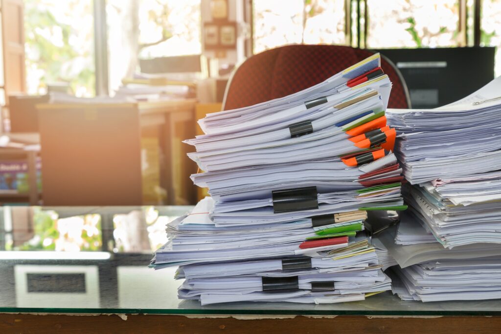 Close up of business documents stack on desk , report papers stack